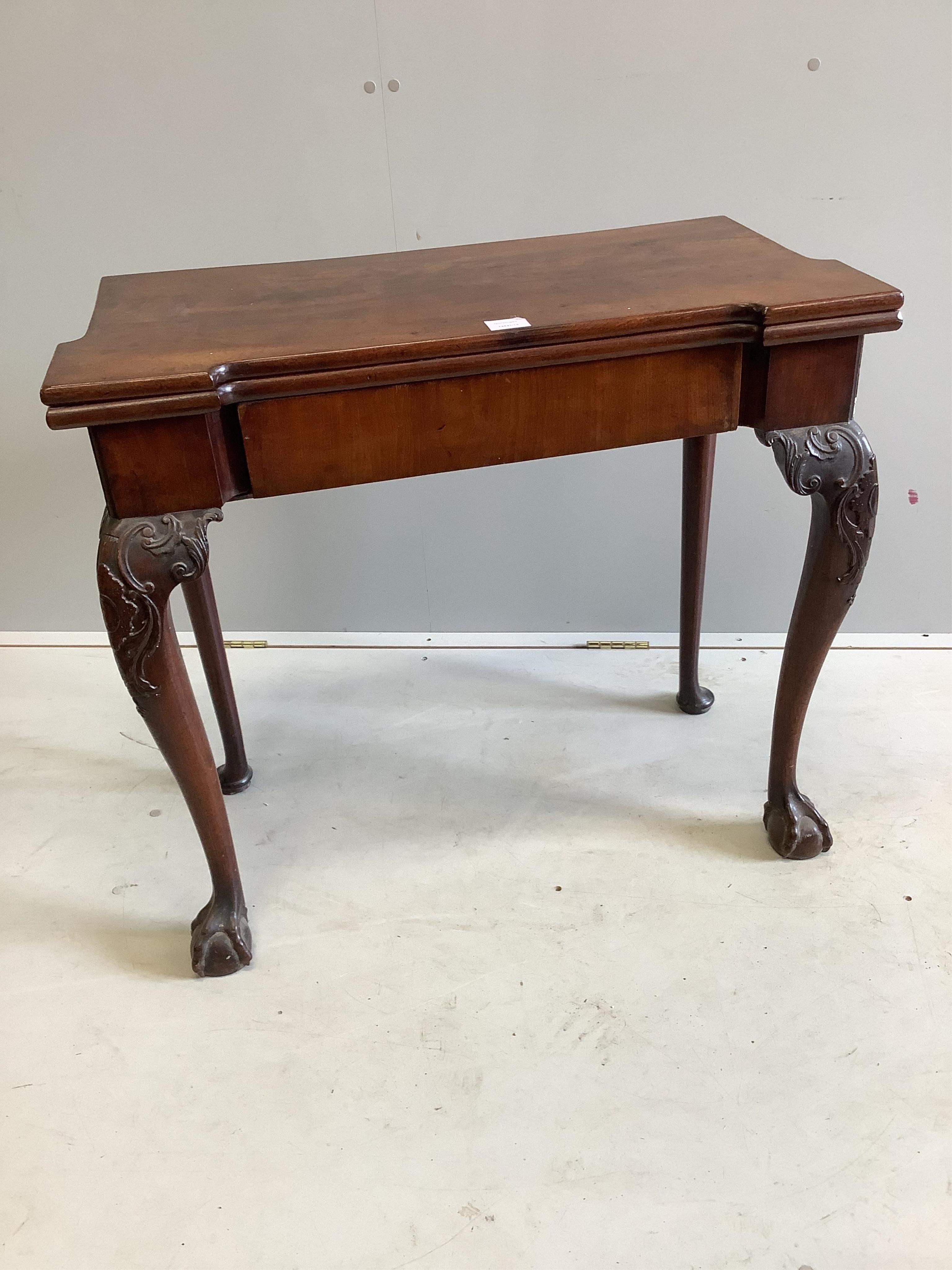 A George II mahogany folding card table, width 83cm, depth 41cm, height 74cm. Condition - fair